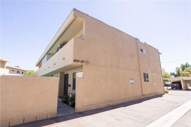 view of side of property with stucco siding
