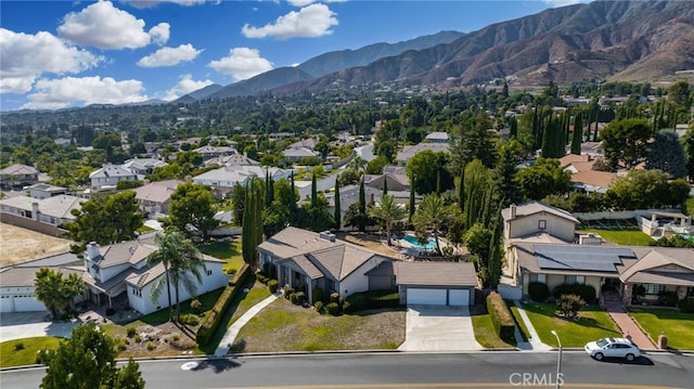 birds eye view of property featuring a mountain view