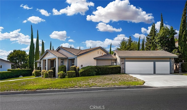 single story home featuring a front lawn and a garage