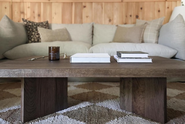 living room with wood walls