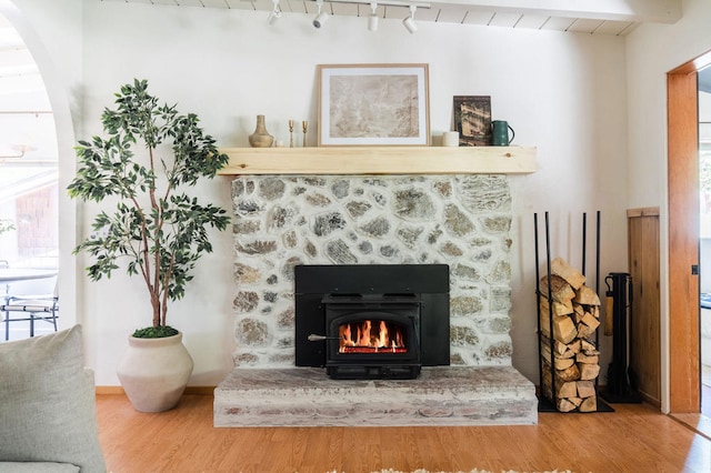 interior details with beam ceiling and hardwood / wood-style floors