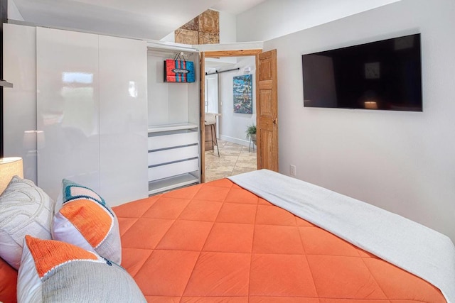 bedroom featuring light tile patterned flooring