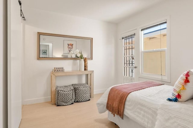 bedroom with light hardwood / wood-style floors