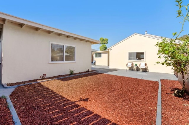 rear view of property with a patio area