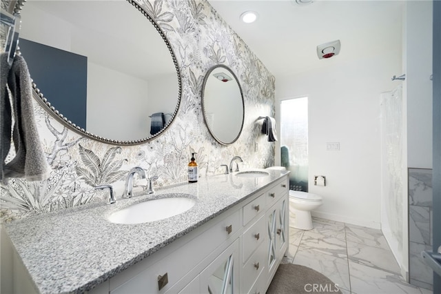 bathroom featuring vanity and toilet