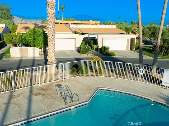 view of swimming pool featuring a mountain view