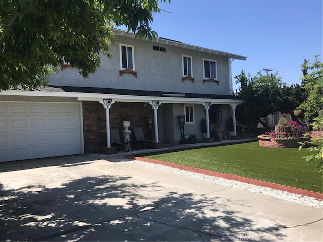 view of front facade featuring an attached garage, a front lawn, covered porch, stucco siding, and driveway