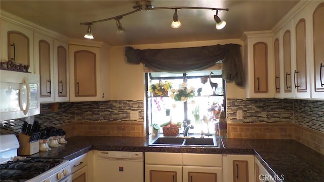 kitchen featuring white appliances, a sink, tile counters, white cabinets, and backsplash