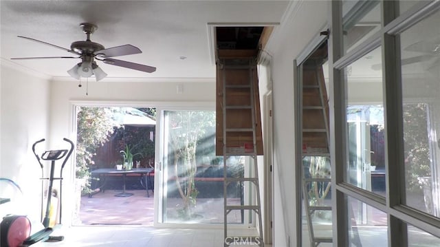 entryway with crown molding and a ceiling fan