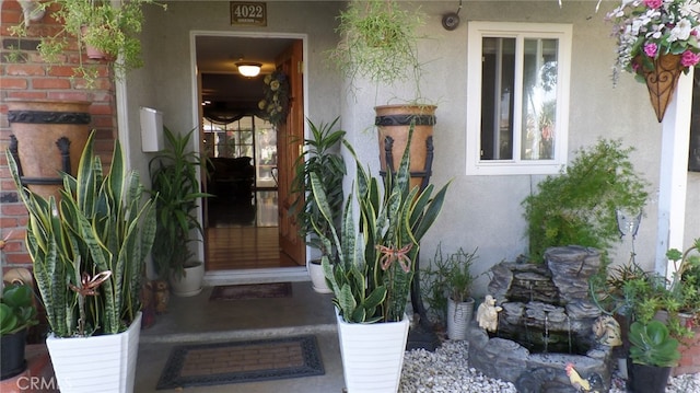 doorway to property with stucco siding