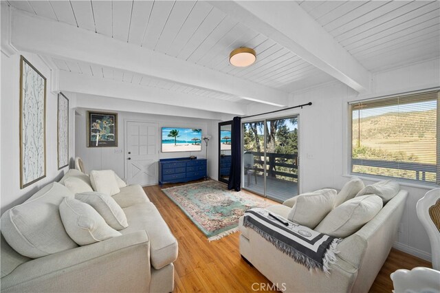 living room featuring wooden ceiling, beam ceiling, and hardwood / wood-style floors