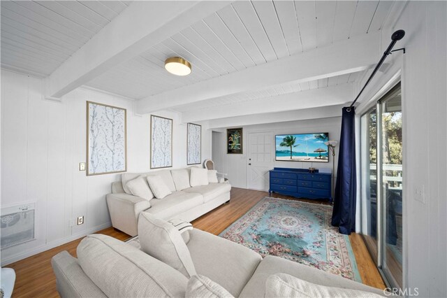 living room with beam ceiling and hardwood / wood-style floors