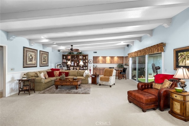 carpeted living room featuring vaulted ceiling with beams and ceiling fan