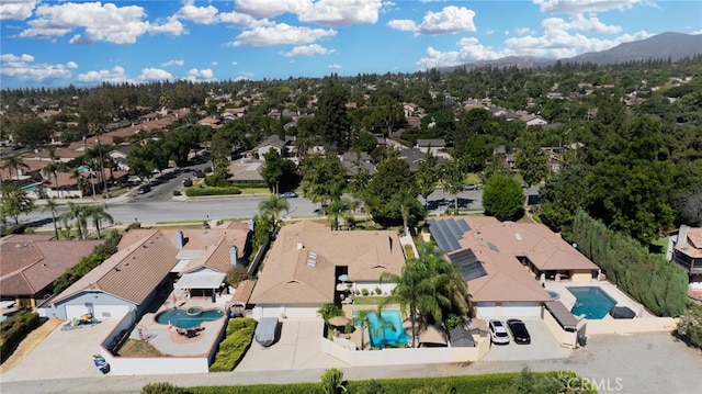 birds eye view of property featuring a mountain view