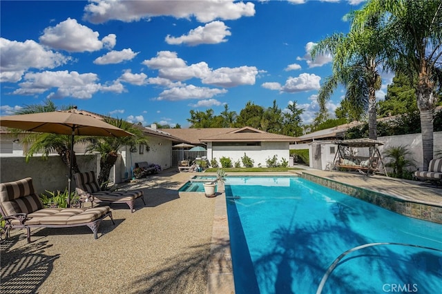 view of swimming pool with a patio area