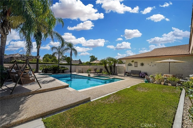 view of swimming pool featuring a yard and a patio area