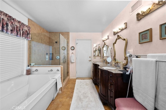 bathroom with independent shower and bath and vanity