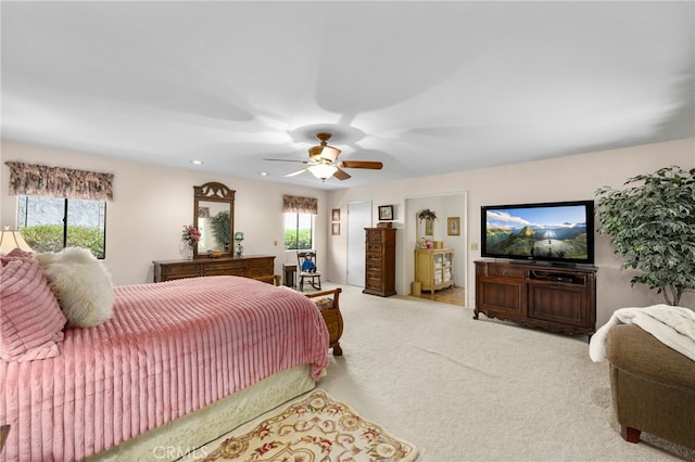 carpeted bedroom featuring ceiling fan