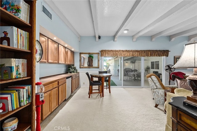 kitchen featuring beamed ceiling, light colored carpet, and stainless steel dishwasher