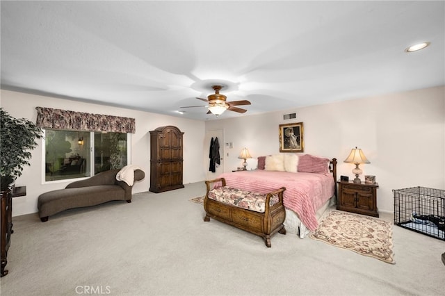 bedroom featuring ceiling fan and light colored carpet