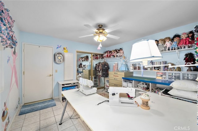 interior space with light tile patterned flooring and ceiling fan