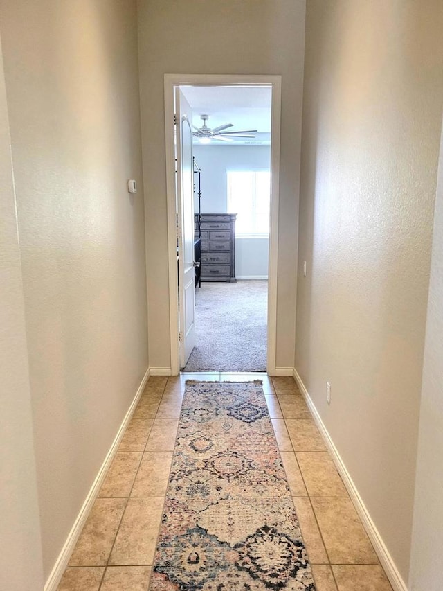 corridor featuring light tile patterned flooring