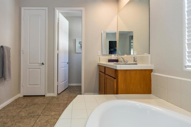 bathroom with tile patterned flooring and vanity