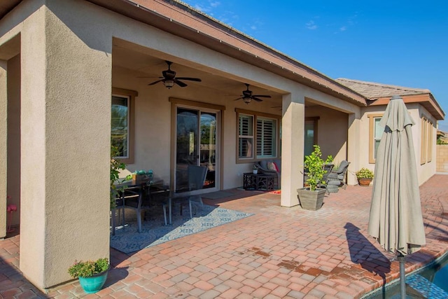 view of patio featuring ceiling fan