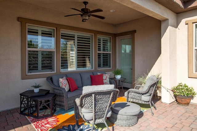 view of patio with an outdoor hangout area, baseboard heating, and ceiling fan