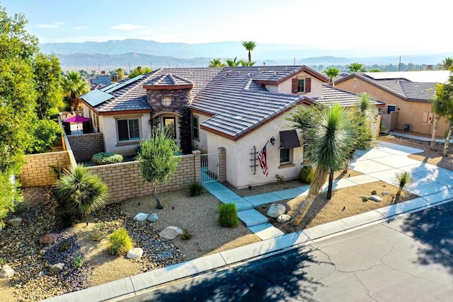 view of front of property with a mountain view