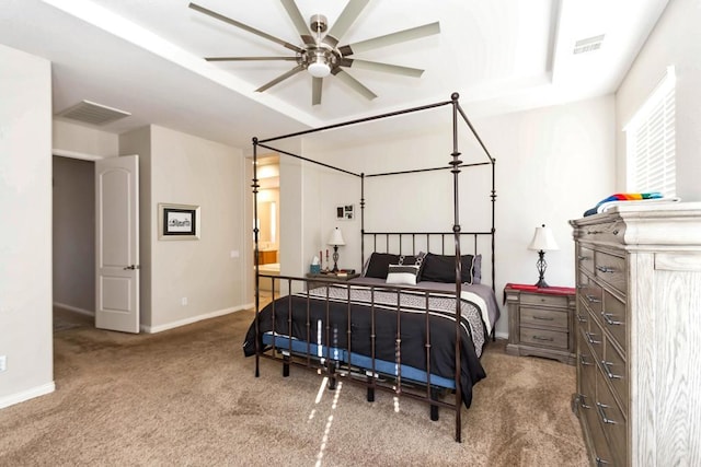 bedroom with carpet, ensuite bathroom, and ceiling fan