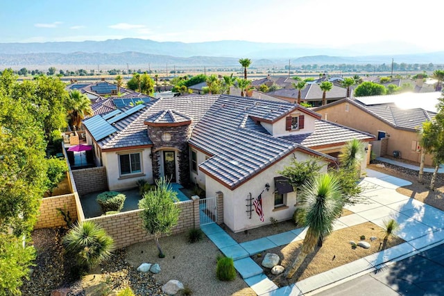 birds eye view of property with a mountain view