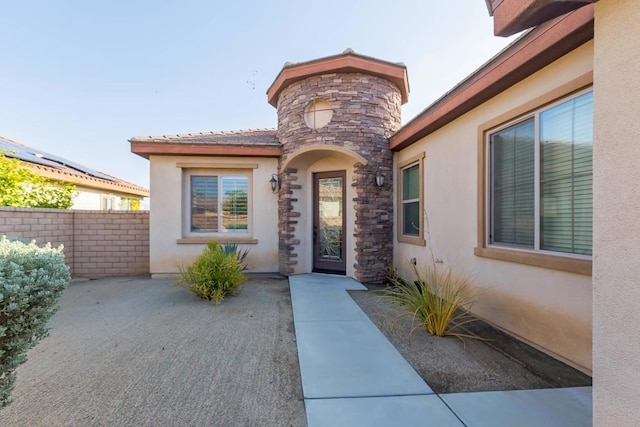 doorway to property with a patio