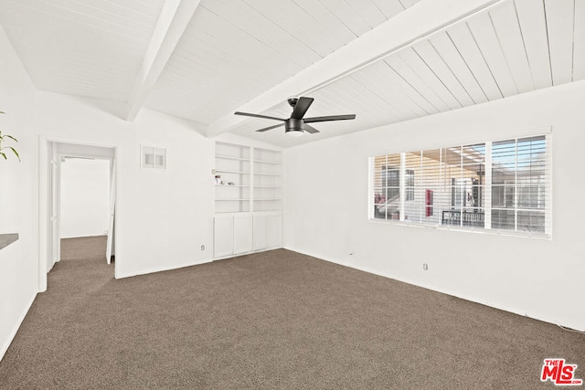 unfurnished bedroom with beam ceiling, dark colored carpet, and ceiling fan