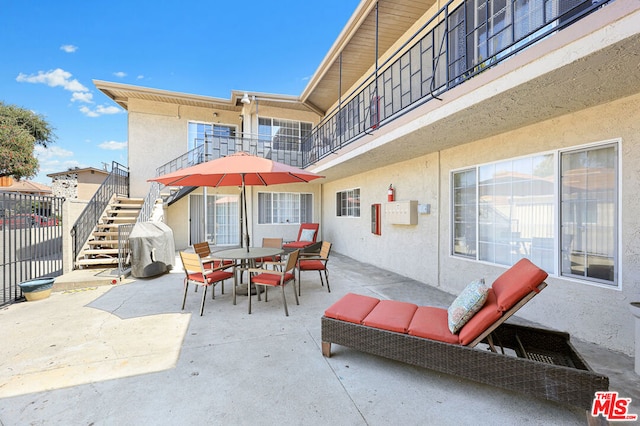 view of patio with a balcony