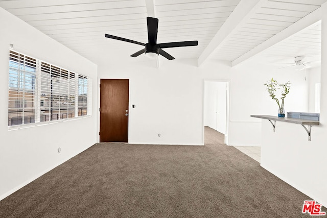 unfurnished living room featuring ceiling fan, beam ceiling, and carpet flooring