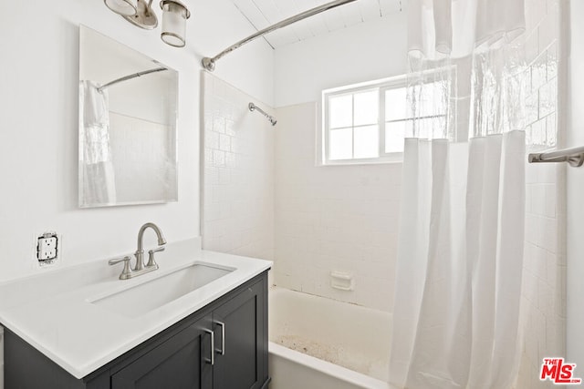 bathroom with vanity and shower / bathtub combination with curtain