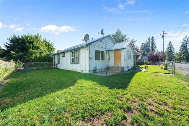 view of property exterior with a lawn