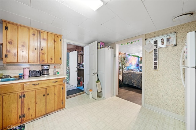 kitchen with white fridge and sink