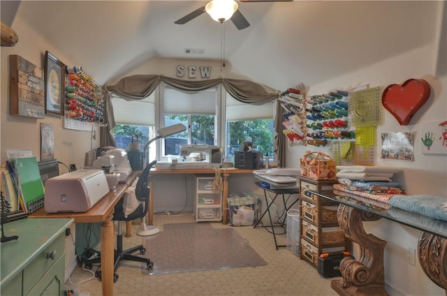 home office with lofted ceiling and ceiling fan