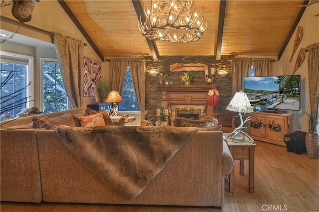 living room featuring wood ceiling, vaulted ceiling with beams, a notable chandelier, a fireplace, and wood-type flooring