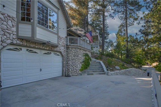 view of side of property with a garage