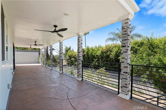 view of patio / terrace featuring a balcony and ceiling fan