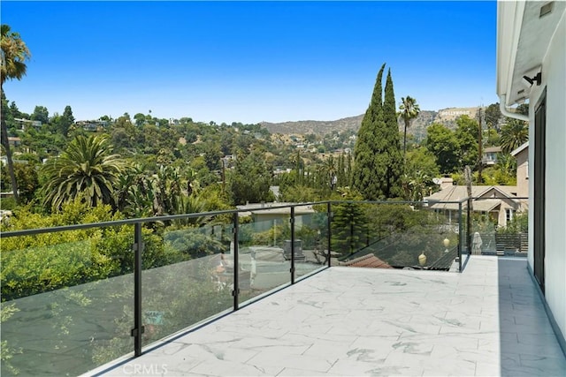 balcony featuring a mountain view