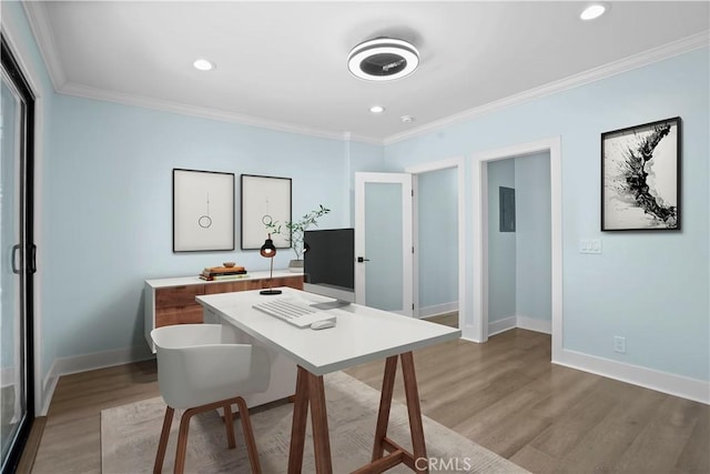 home office with wood-type flooring and crown molding