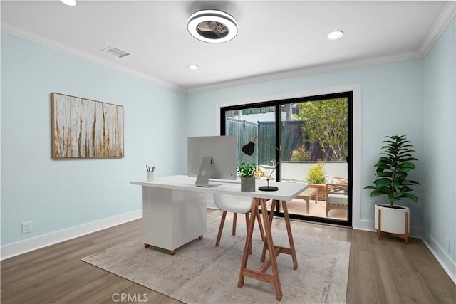 office with dark hardwood / wood-style flooring and crown molding