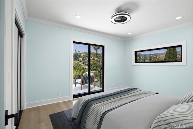 bedroom featuring access to exterior, hardwood / wood-style floors, and ornamental molding