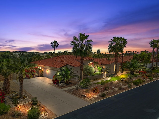 mediterranean / spanish-style home featuring a garage