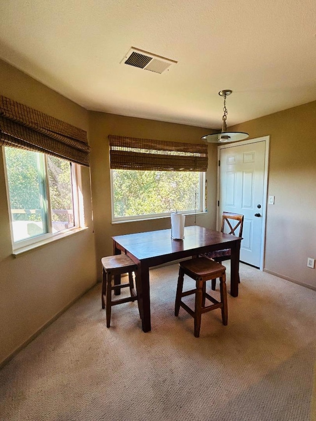 view of carpeted dining space