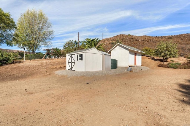 view of outdoor structure featuring a mountain view